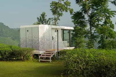 Futuristic XPod Villa Exterior Futuristic xpod wayanad villa exterior with glass front at boCHE 1000 Acres resort in wayanad