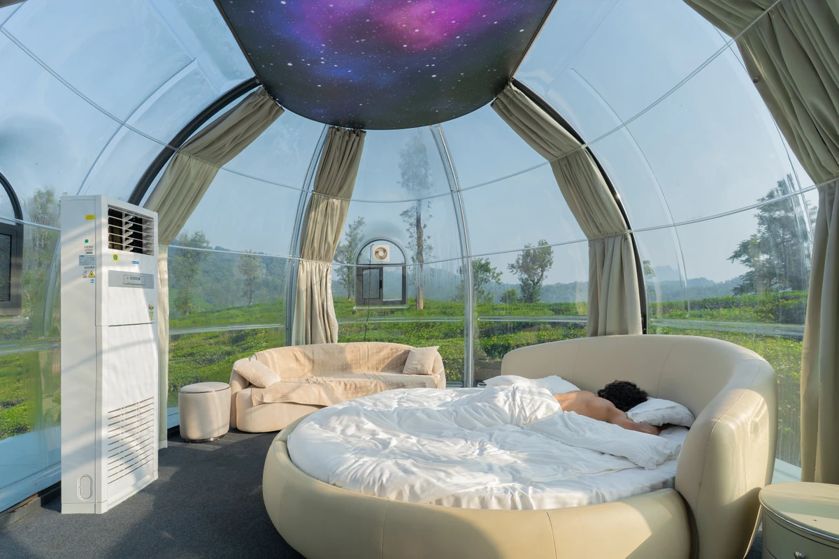 Modern styling and cozy ambient lighting of the dome room, perfect for wayanad resort packages