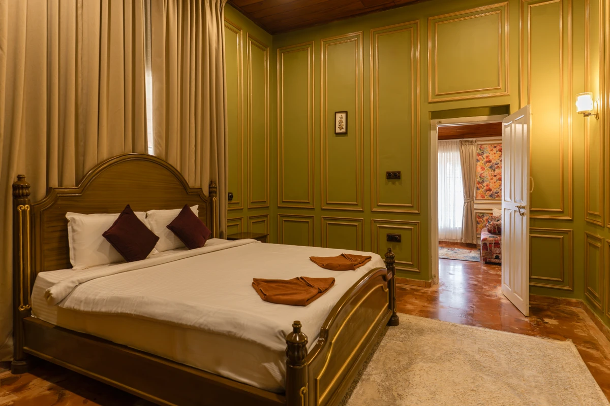 Luxurious Royal Bedroom Suite Luxurious royal-themed villa bedroom at boCHE 1000 Acre resort, offering a premium stay in Wayanad